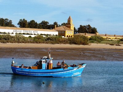 Fishing boat on water outside arraial ferreira neto, near Tavira Island Ferry Terminal, Portugal