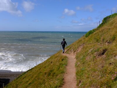 Person hiking the national trail UK coast to coast route from St Bees to Robin Hoods Bay