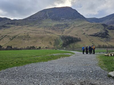 Navigation skills group on bend of path with High Stile in background, Buttermere, Lake District, Cumbria